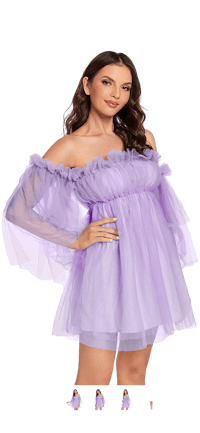 a woman in a purple dress posing for a photo
