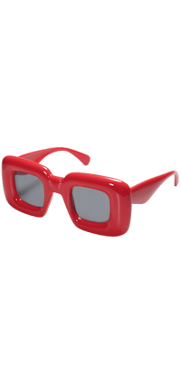 a pair of red sunglasses on a black background